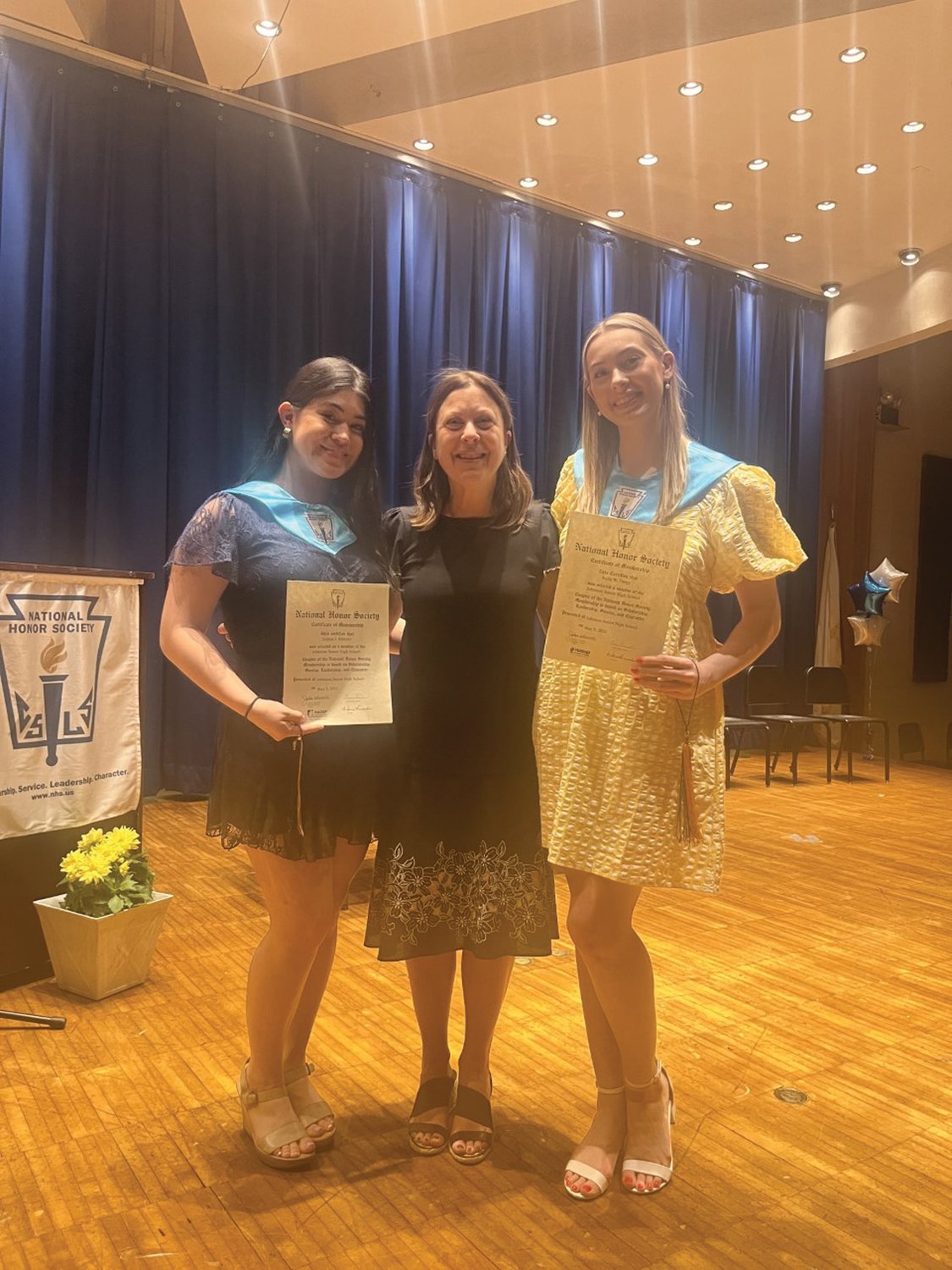 Sophia Ribezzo, Emilia Ruggiero and Kelly Dargy, pose for a photo at this year’s National Honor Society ceremony at Johnston High School.